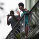 Beyoncé is seen on a balcony of the Saratoga Hotel in Havana next to her husband, Jay Z, on April 5, 2013.
STR/AFP/Getty Images